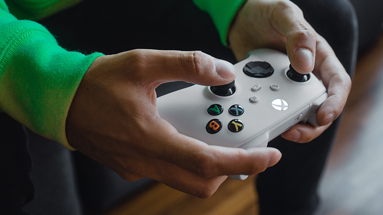 Person holding a Xbox Wireless Controller