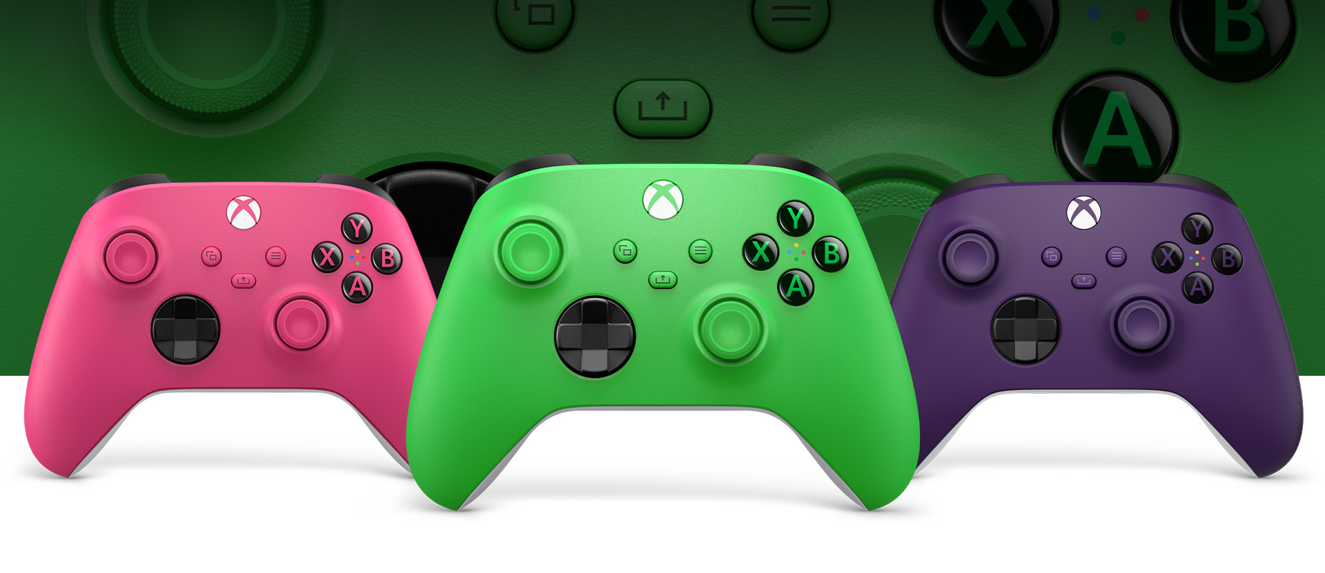 Xbox Green controller in front with Pink on left and Purple on right