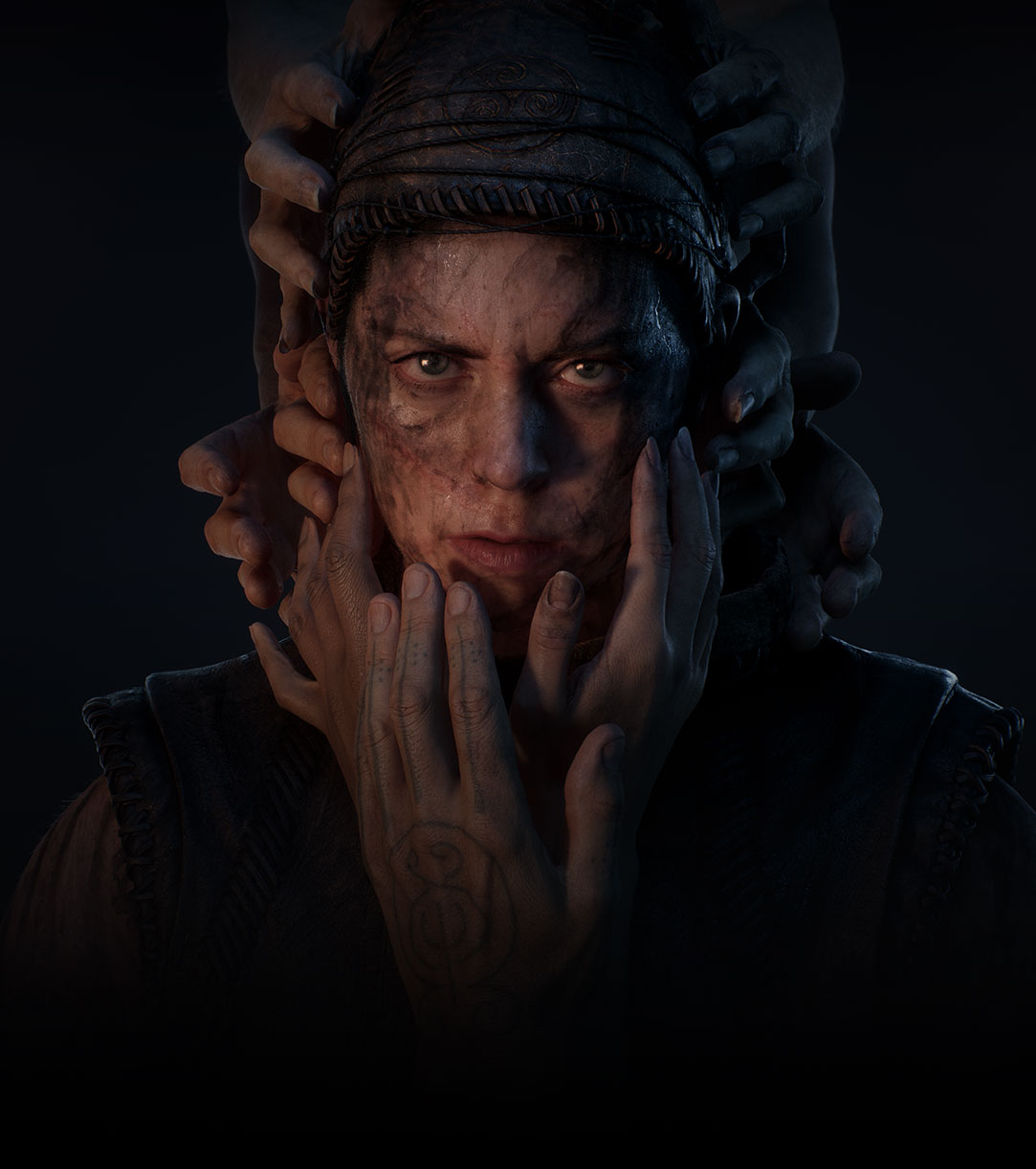 Senua peers into the darkness as a mass of hands grasp around her face.