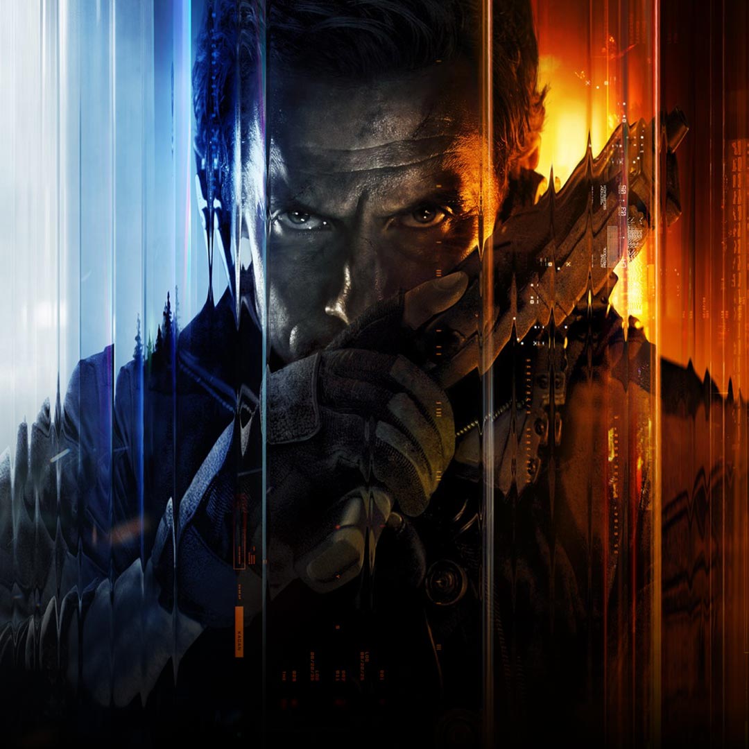 A man looking forward with a serious expression while holding a hand gun in front of his face. 