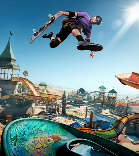 Tony Hawk airwalks over a ramp in an expansive skate park.