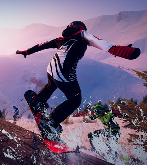 A snowboarder jumping off of a log down a mountainous snowy landscape. 