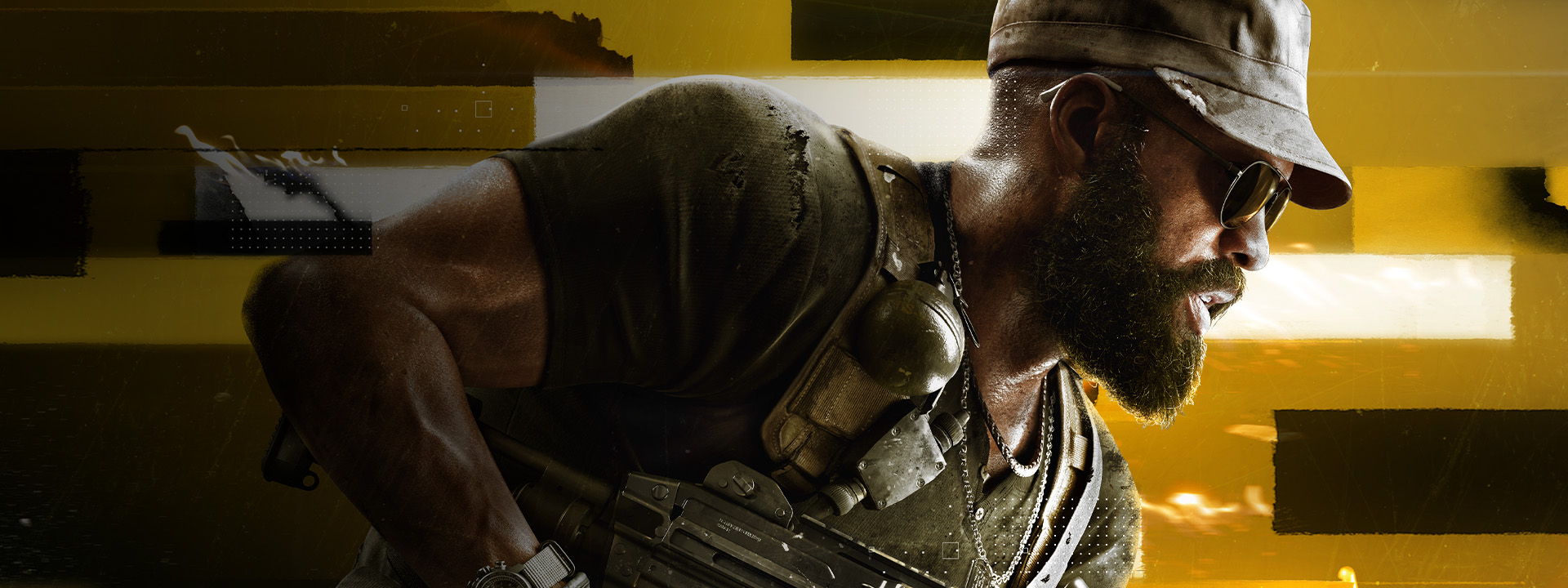 A man dressed in military gear and sunglasses charges forward while holding a rifle under his arm.