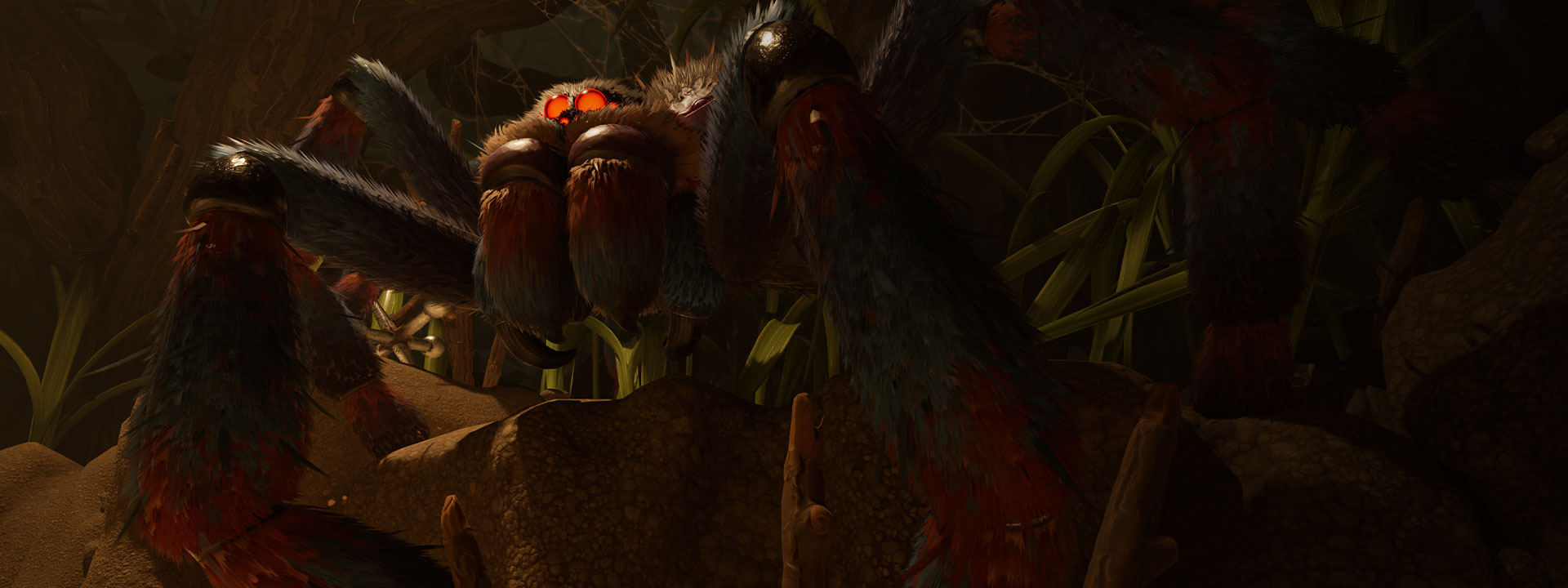 AXL, a large hairy tarantula with glowing red eyes, stands in the dirt and grass. 