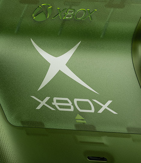 Close up of the original XBOX logo on the back of controller