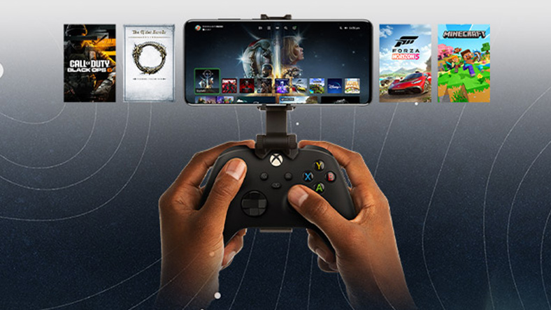 A mobile device is clipped to an Xbox controller, showcasing a selection of titles to play. The world of Starfield stretches beyond the phone.