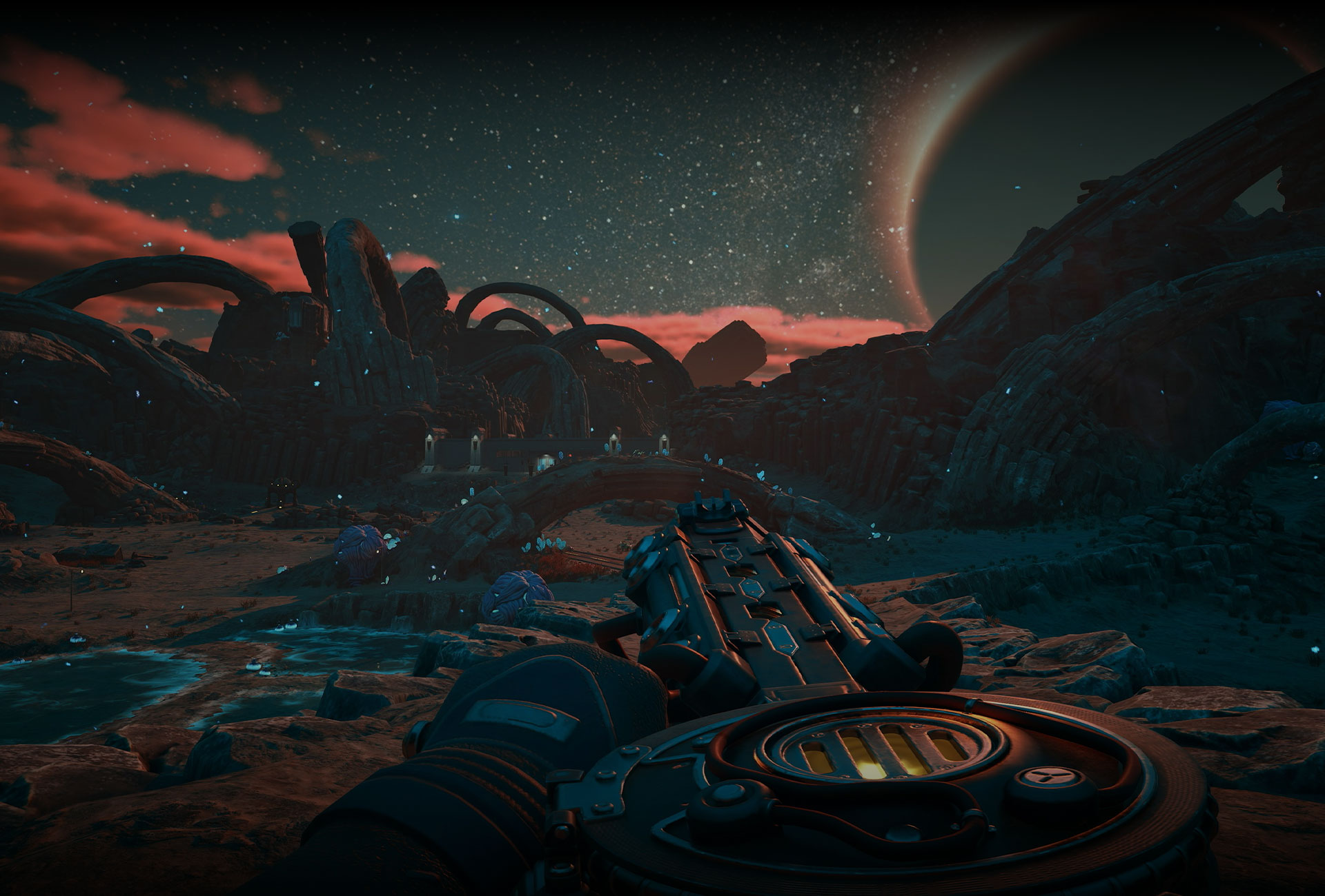 At sunset, a futuristic city shines dimly on the edge of a jungle and rocky mountaintops.