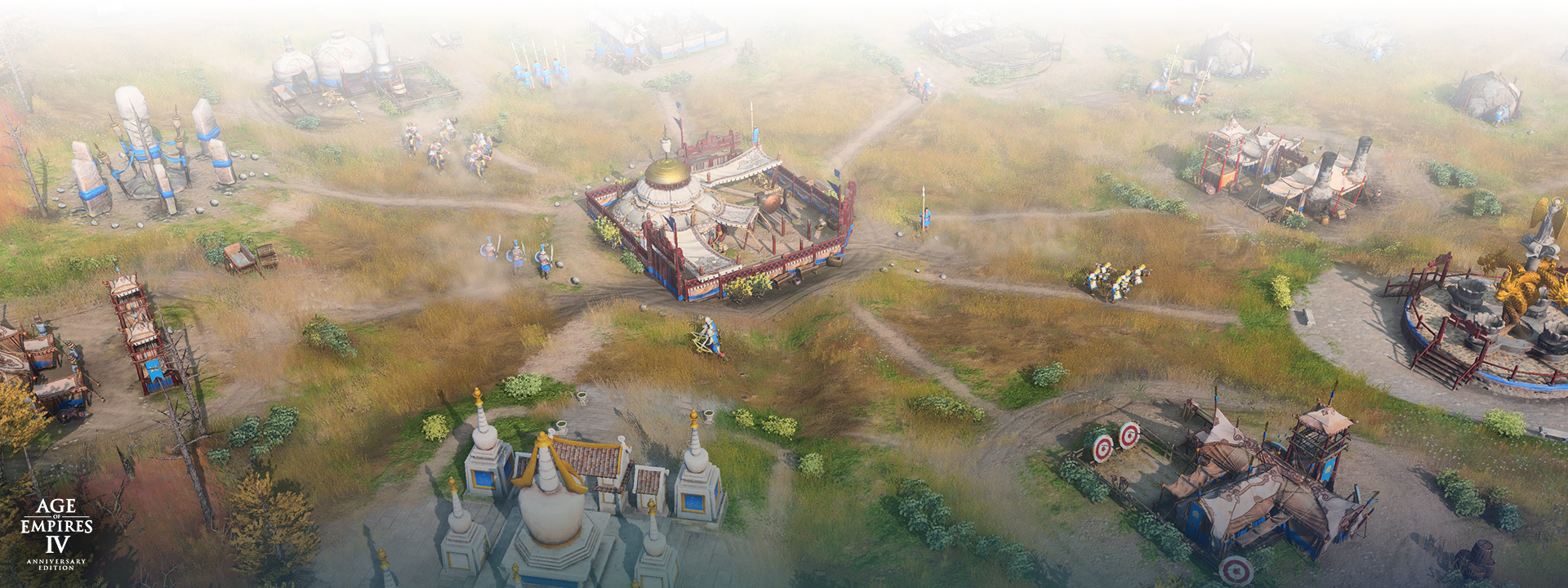 Age of Empires IV Anniversary Edition logo, an overview of a town center and its surrounding buildings.