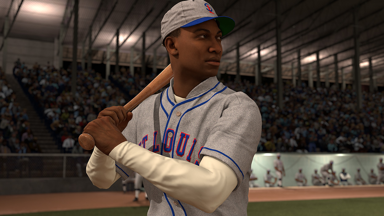 A player from the St. Luis Stars looking out to the field as he waits for a pitch.