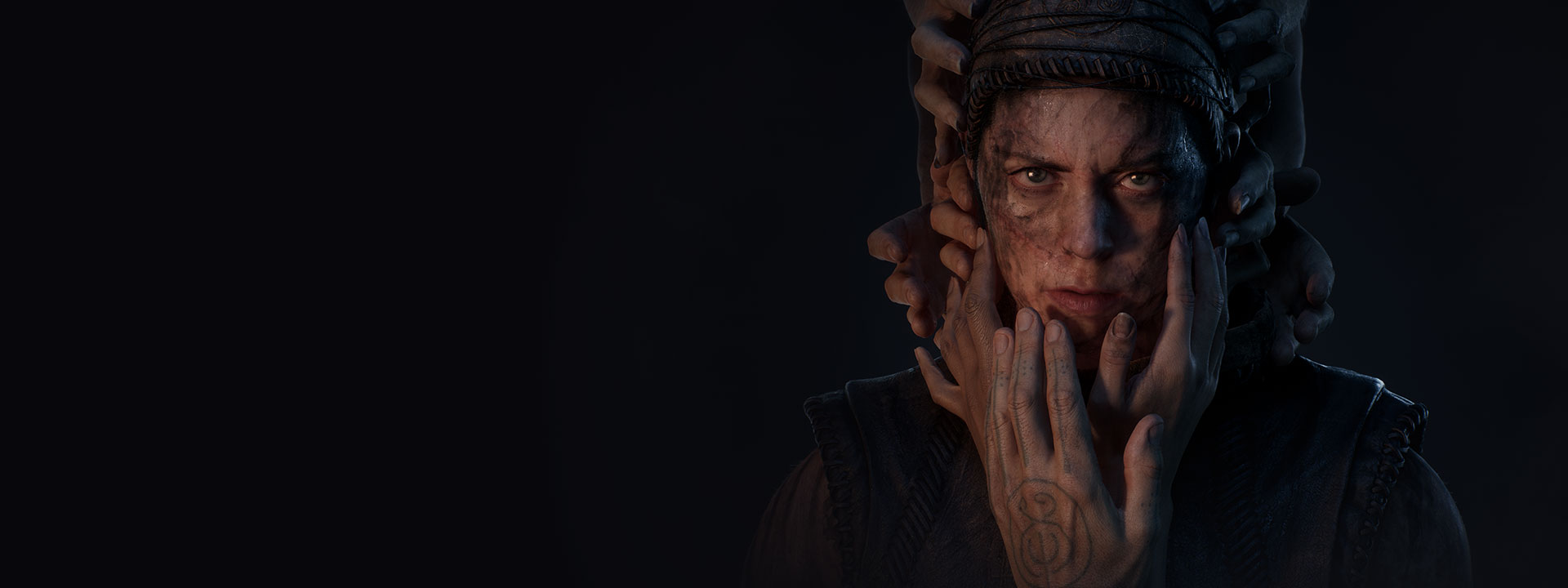A woman in handmade leather clothes gazes intensely as hands reach out to cover her face.