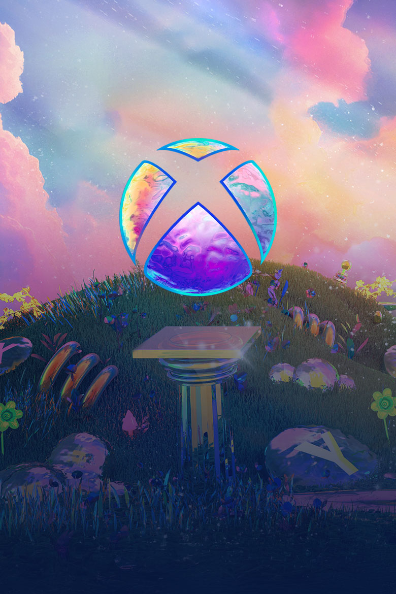 The Xbox logo on a pillar in front of a grassy hill