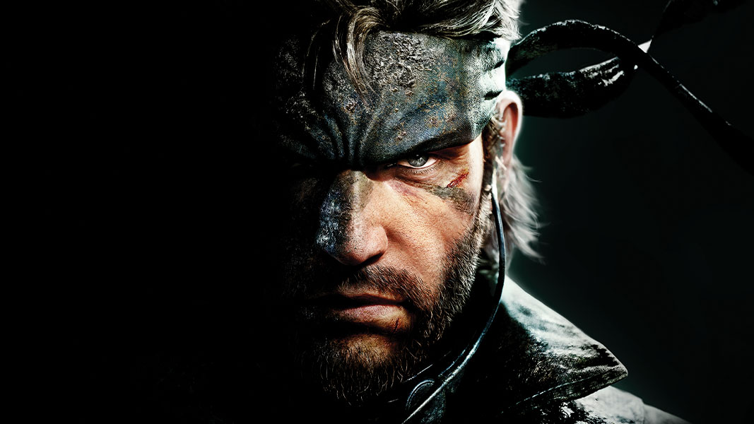 Pohled zblízka na tvář Solid Snakea, která se ztrácí v temnotě