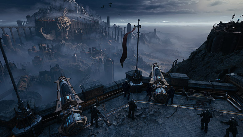 A group of soldiers man the armaments of a cliffside fortress.