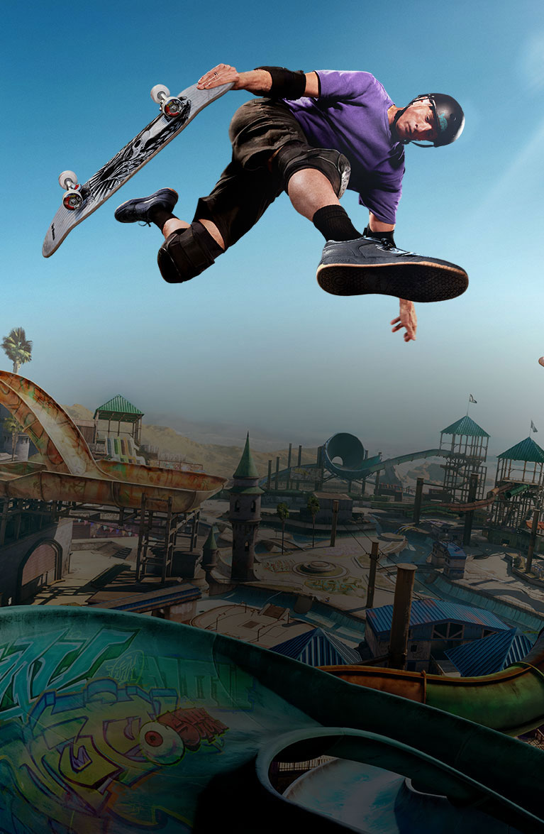 Tony Hawk airwalks over a ramp in an expansive skate park.